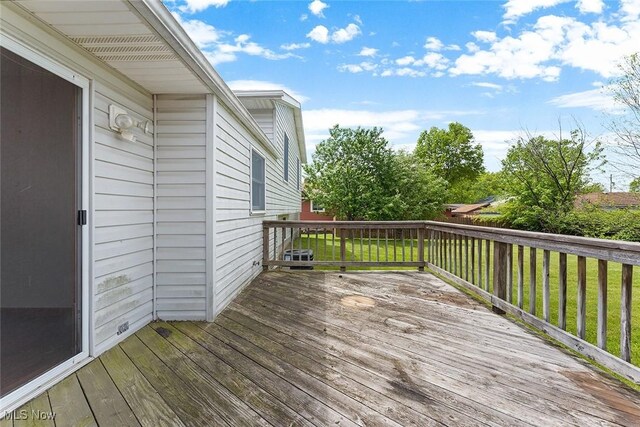 67 Chestnut Ave, Northfield, OH 44067 - wooden deck with a lawn