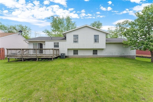 67 Chestnut Ave, Northfield, OH 44067 - back of property featuring central AC, a deck, a lawn, and a shingled roof