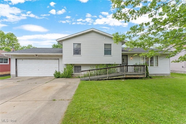 67 Chestnut Ave, Northfield, OH 44067 - tri-level home with driveway, a garage, a front lawn, roof with shingles, and a deck