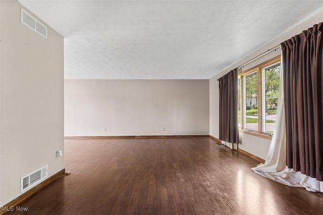 67 Chestnut Ave, Northfield, OH 44067 - spare room with wood finished floors, baseboards, and a textured ceiling