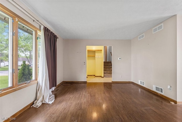 67 Chestnut Ave, Northfield, OH 44067 - empty room with baseboards, wood finished floors, and stairs