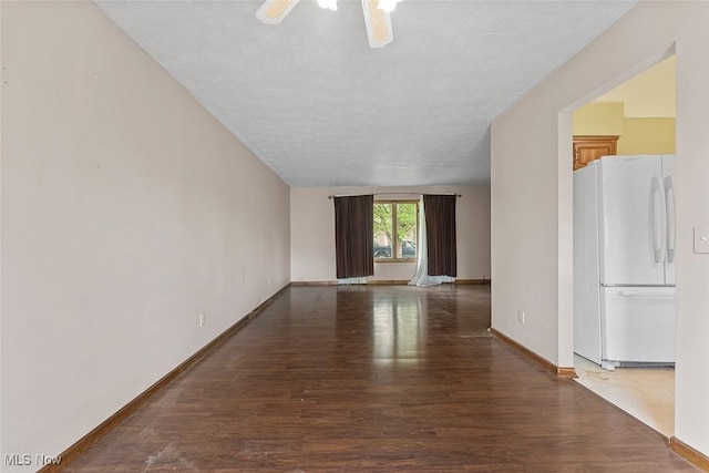 67 Chestnut Ave, Northfield, OH 44067 - unfurnished room with a textured ceiling, wood finished floors, a ceiling fan, and baseboards