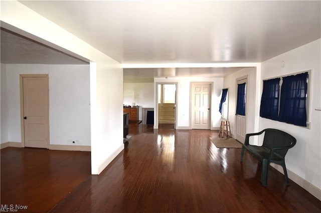 7833 Pymatuning Lake Rd, Williamsfield, OH 44093 - living area with baseboards and dark wood-type flooring