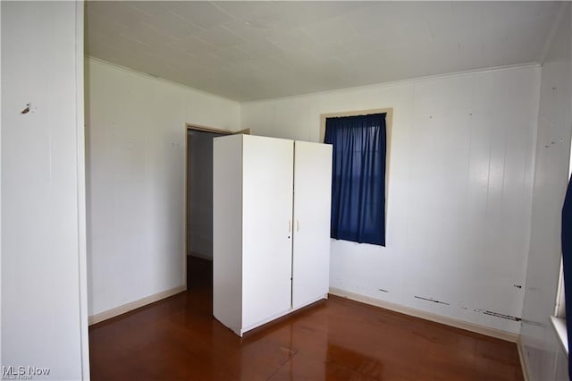 7833 Pymatuning Lake Rd, Williamsfield, OH 44093 - unfurnished bedroom featuring wood finished floors and crown molding
