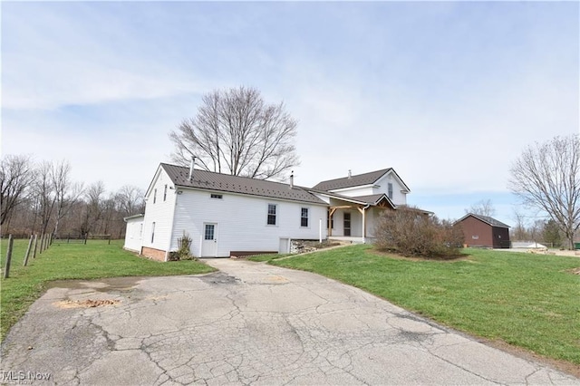 7833 Pymatuning Lake Rd, Williamsfield, OH 44093 - view of front of home with a front lawn and metal roof