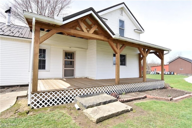 7833 Pymatuning Lake Rd, Williamsfield, OH 44093 - doorway to property featuring a yard, a porch, and metal roof