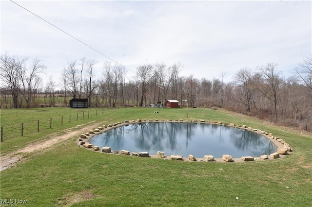 7833 Pymatuning Lake Rd, Williamsfield, OH 44093 - view of pool featuring a lawn, a swimming pool, and an outbuilding