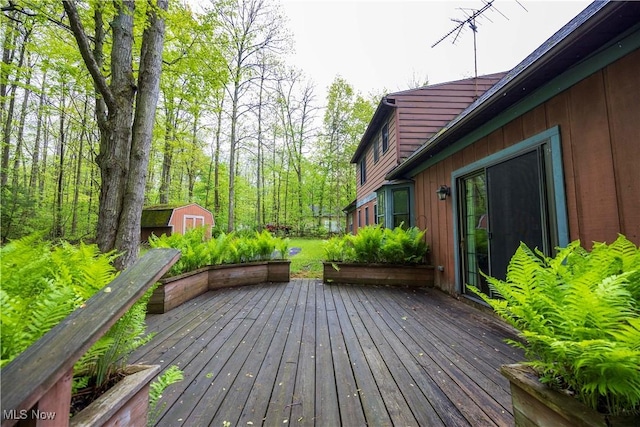 8665 Prescott Dr, Chesterland, OH 44026 - wooden terrace with a storage unit and an outbuilding