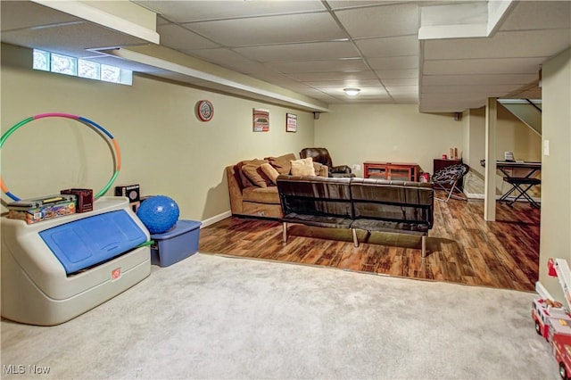 650 Thornhill Ln, Aurora, OH 44202 - living area with a drop ceiling, carpet, baseboards, and wood finished floors