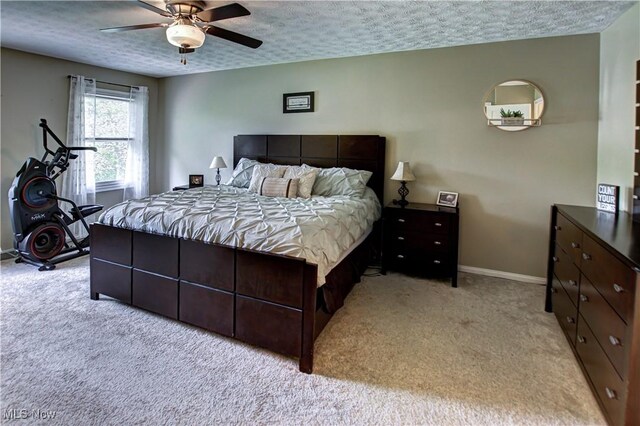 650 Thornhill Ln, Aurora, OH 44202 - bedroom featuring light carpet, a textured ceiling, baseboards, and a ceiling fan