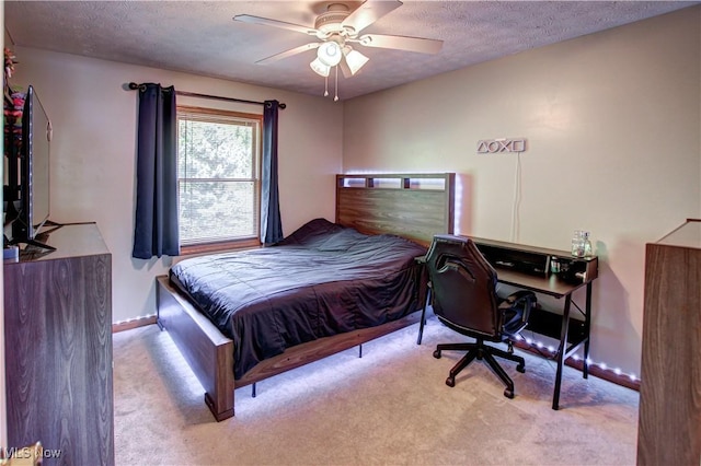 650 Thornhill Ln, Aurora, OH 44202 - carpeted bedroom with a textured ceiling, baseboards, a desk, and a ceiling fan