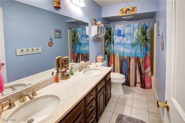 650 Thornhill Ln, Aurora, OH 44202 - bathroom featuring tile patterned floors, double vanity, toilet, and a shower with curtain