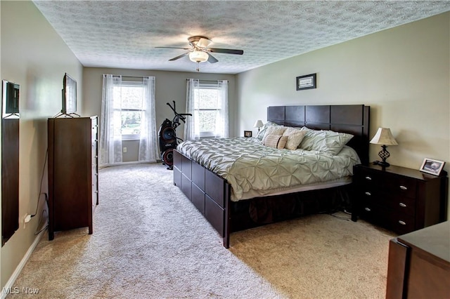 650 Thornhill Ln, Aurora, OH 44202 - bedroom with light carpet, a textured ceiling, and ceiling fan