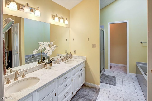 650 Thornhill Ln, Aurora, OH 44202 - bathroom with marble look tile flooring, a stall shower, double vanity, and baseboards