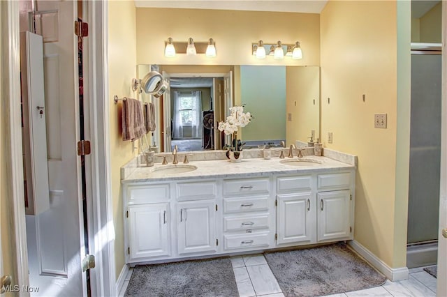 650 Thornhill Ln, Aurora, OH 44202 - full bathroom with double vanity, a stall shower, baseboards, and tile patterned floors
