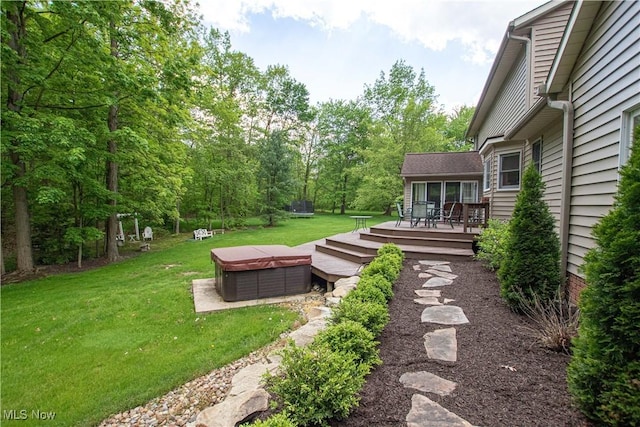 650 Thornhill Ln, Aurora, OH 44202 - view of green lawn featuring a deck and outdoor dining area