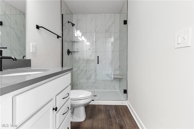 374 Bascule Dr, Lorain, OH 44052 - full bath featuring vanity, wood finished floors, and a marble finish shower