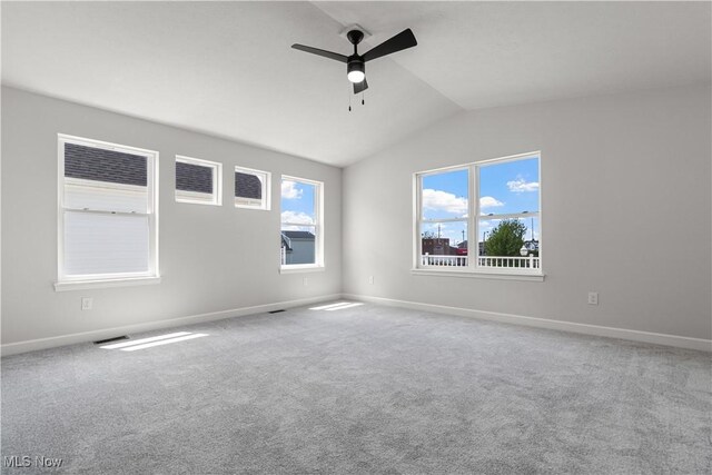 374 Bascule Dr, Lorain, OH 44052 - carpeted empty room with a ceiling fan and vaulted ceiling