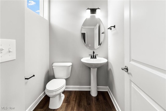 374 Bascule Dr, Lorain, OH 44052 - half bath with toilet and wood finished floors