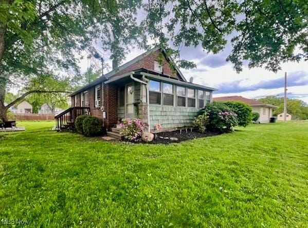 39 Wayne St, Niles, OH 44446 - view of home's exterior featuring a yard
