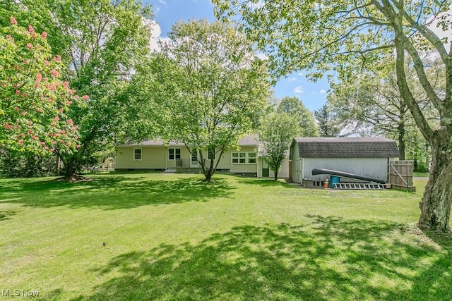 13970 E Willard Rd, Novelty, OH 44072 - view of grassy yard featuring an outdoor structure and a storage unit