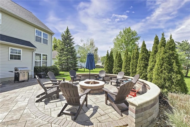 view of patio featuring a fire pit and area for grilling