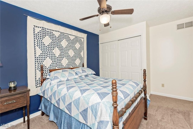 5141 Chillicothe Rd, Chagrin Falls, OH 44022 - carpeted bedroom with a closet, baseboards, a textured ceiling, and ceiling fan