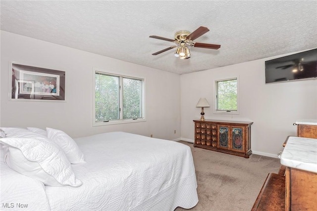 5141 Chillicothe Rd, Chagrin Falls, OH 44022 - bedroom featuring light colored carpet, baseboards, a textured ceiling, and ceiling fan