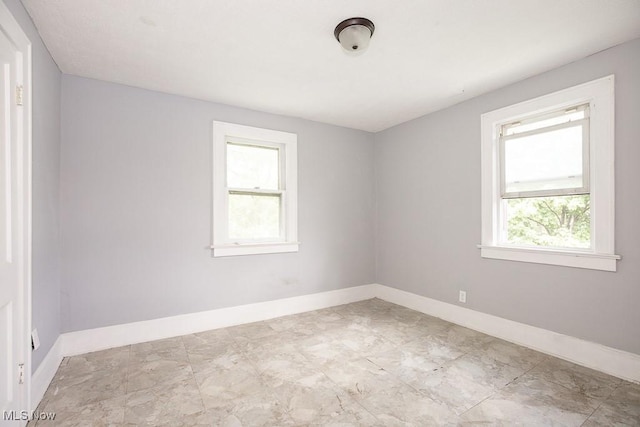 408 Bacon, Akron, OH 44320 - unfurnished room with healthy amount of natural light and baseboards