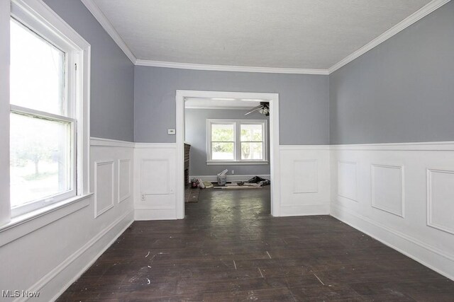 408 Bacon, Akron, OH 44320 - unfurnished room featuring a wainscoted wall, ceiling fan, wood finished floors, crown molding, and a decorative wall