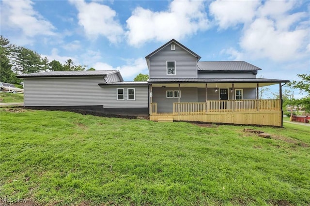 35 W 5th St, Dresden, OH 43821 - back of house featuring a lawn, metal roof, and a porch