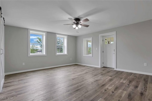 35 W 5th St, Dresden, OH 43821 - empty room with a ceiling fan, wood finished floors, and baseboards