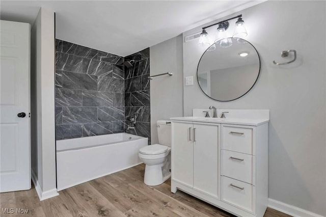 35 W 5th St, Dresden, OH 43821 - full bathroom with wood finished floors, toilet, vanity, and tub / shower combination