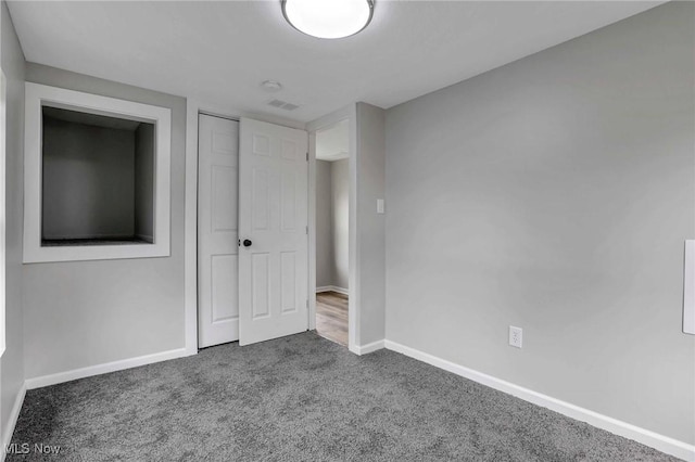 35 W 5th St, Dresden, OH 43821 - unfurnished bedroom featuring carpet, baseboards, and a closet