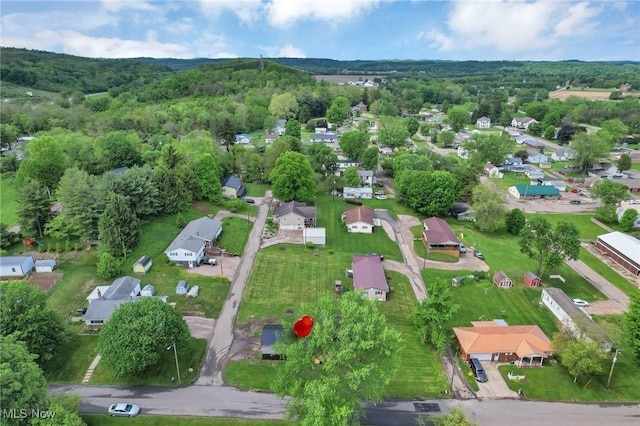 35 W 5th St, Dresden, OH 43821 - aerial overview of property's location with nearby suburban area and a forest