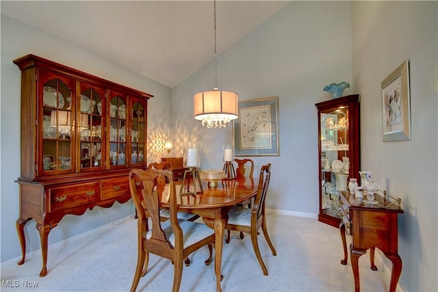 401 Bounty Way, Avon Lake, OH 44012 - carpeted dining space with baseboards and high vaulted ceiling