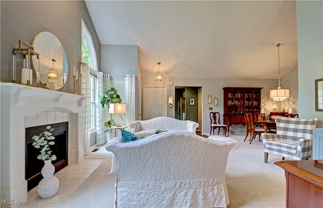 401 Bounty Way, Avon Lake, OH 44012 - living room featuring light carpet, a tiled fireplace, and high vaulted ceiling