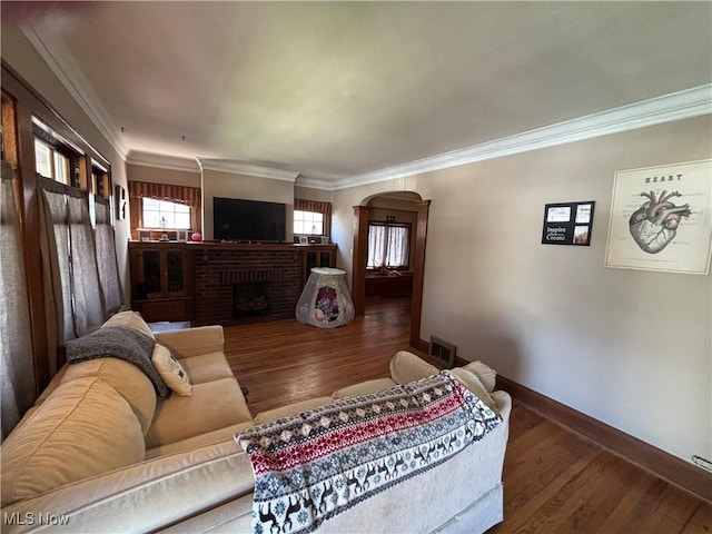 4212 W 48th St, Cleveland, OH 44144 - living area with a fireplace, arched walkways, wood finished floors, baseboards, and ornamental molding
