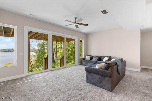 26 Oneida Trl, Malvern, OH 44644 - living area featuring carpet floors, a ceiling fan, and baseboards