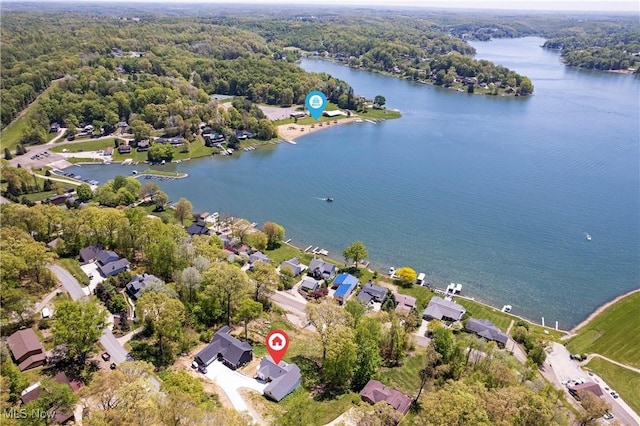 26 Oneida Trl, Malvern, OH 44644 - aerial view of property's location featuring a nearby body of water and a heavily wooded area