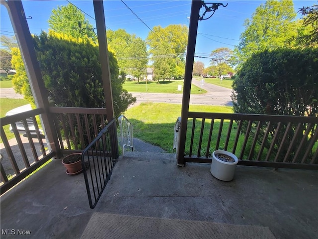 9788 E River Rd, Elyria, OH 44035 - covered porch featuring a lawn