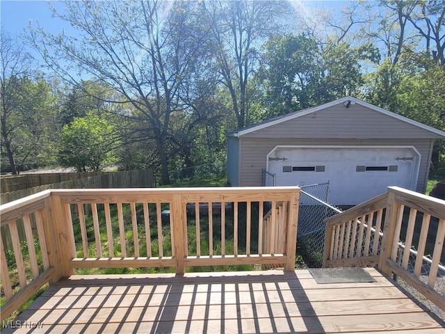 9788 E River Rd, Elyria, OH 44035 - deck featuring a detached garage and an outbuilding