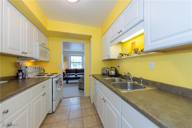 13710 Shaker Blvd Unit 405, Cleveland, OH 44120 - kitchen with white appliances, a sink, white cabinets, and dark countertops
