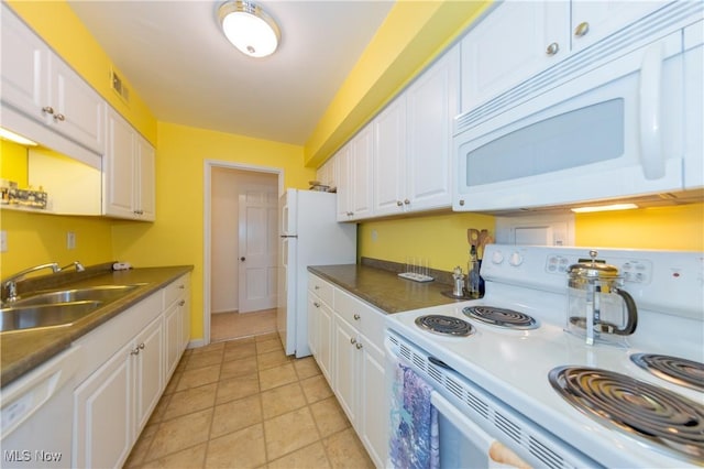 13710 Shaker Blvd Unit 405, Cleveland, OH 44120 - kitchen featuring white appliances, a sink, white cabinets, and dark countertops