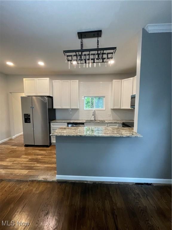 1610 Globe, East Liverpool, OH 43920 - kitchen with appliances with stainless steel finishes, white cabinetry, light stone countertops, and recessed lighting