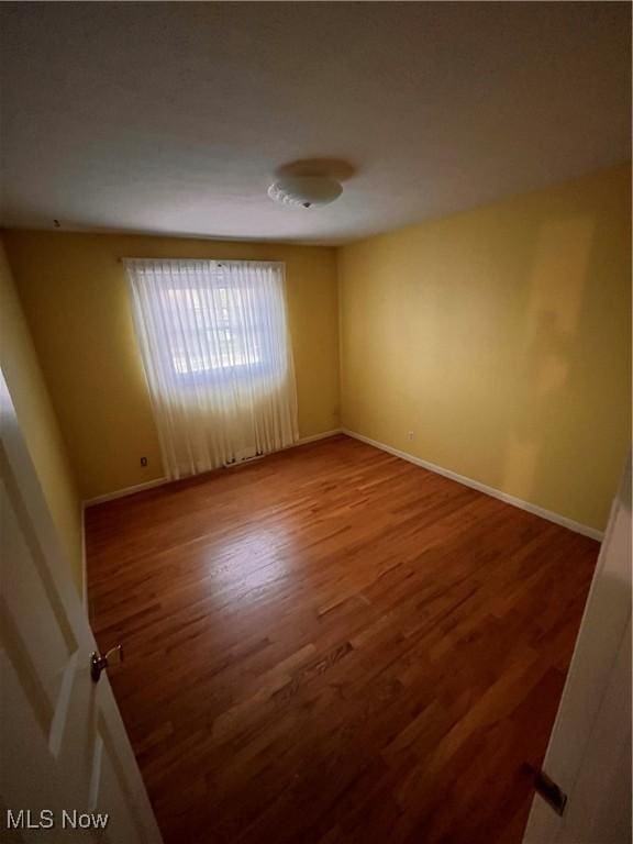 2840 Brian Dr, Parma, OH 44134 - unfurnished room featuring wood finished floors and baseboards