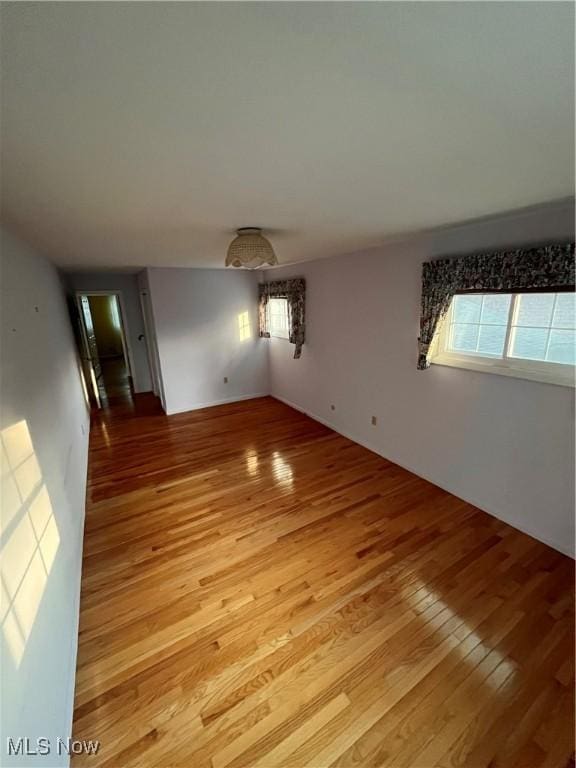 2840 Brian Dr, Parma, OH 44134 - empty room featuring light wood-type flooring and healthy amount of natural light