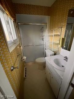 2840 Brian Dr, Parma, OH 44134 - full bath featuring a shower stall, vanity, and toilet