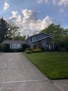 2840 Brian Dr, Parma, OH 44134 - view of front of home with a front yard and driveway