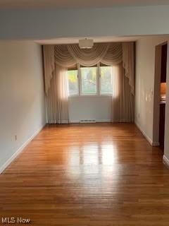 2840 Brian Dr, Parma, OH 44134 - unfurnished room featuring wood finished floors and baseboards